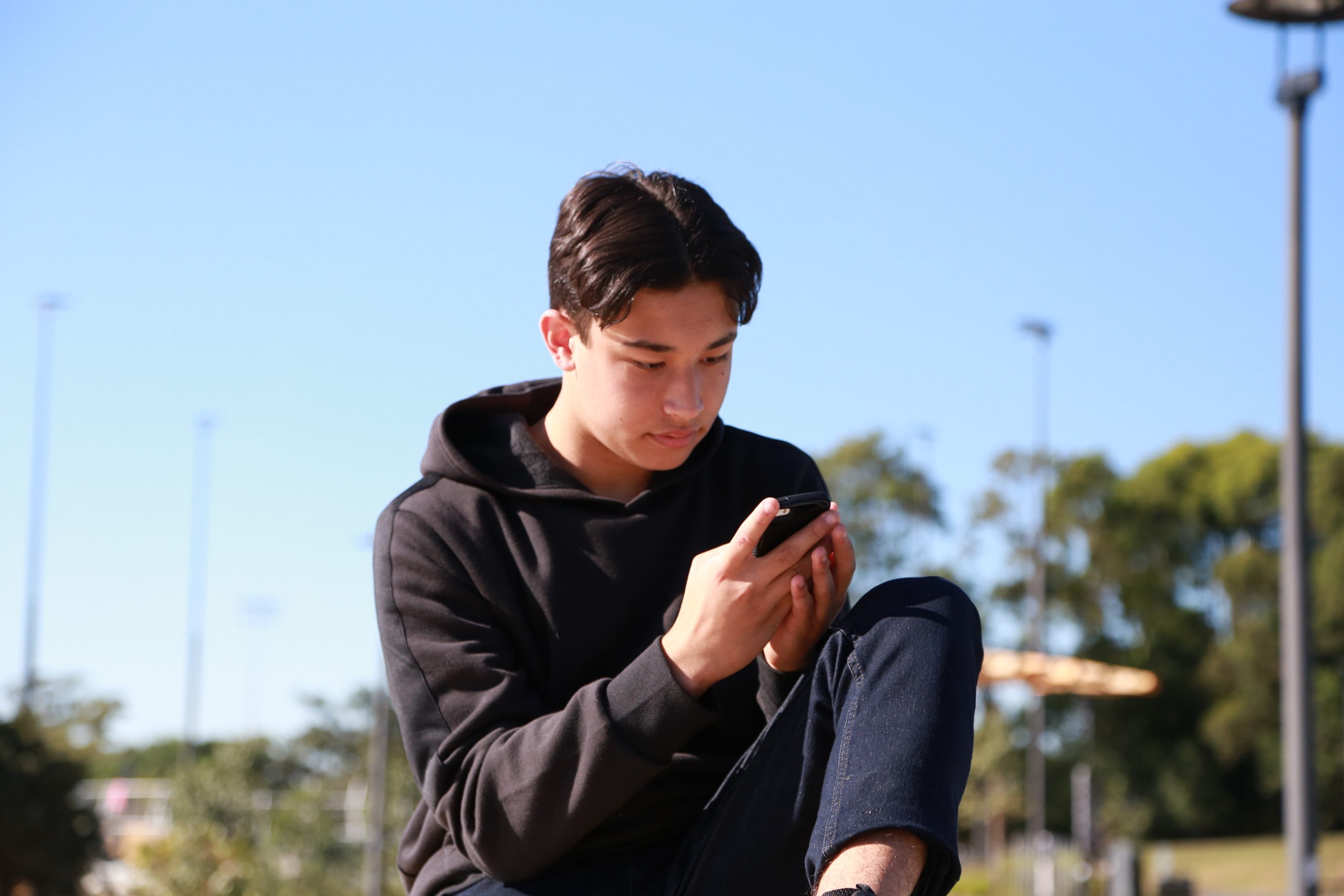 Two teenagers engaged in conversatoin